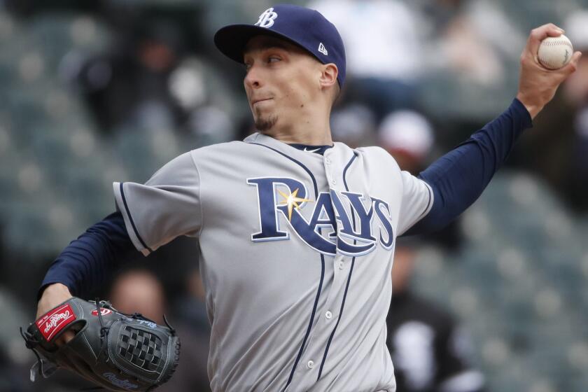 FILE - In this April 10, 2018, file photo, Tampa Bay Rays starting pitcher Blake Snell delivers during the third inning of a baseball game against the Chicago White Sox in Chicago. Snell was announced as the winner of the American League Cy Young Award on Wednesday, Nov. 14, 2018. (AP Photo/Jeff Haynes, File)