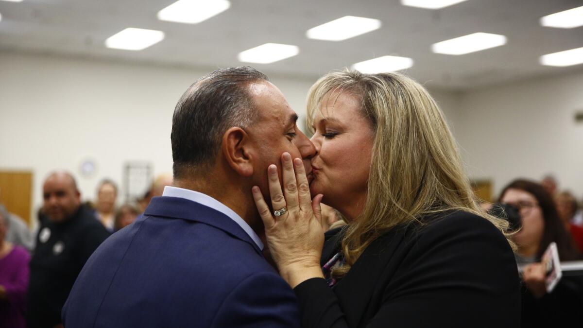 Gil Cisneros, the congressman-elect for California's 39th District, kisses his wife, Jacki, after addressing supporters at a victory rally at a union hall in Buena Park.