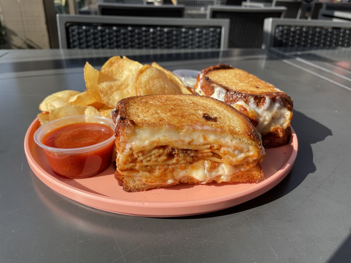 The spaghetti grilled cheese sandwich and chips at the Burnt Crumbs buffet in Irvine.