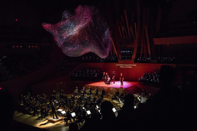 LOS ANGELES, CA - JUNE 1, 2018: Conductor Gustavo Dudamel directs the LA Philharmonic in "Paradise and the Peri," based on an Irish legend about a Persian fairy spirit by Peter Sellars and includes virtual reality, globular 3-D sculptural projections by Refik Anado at Walt Disney Concert Hall on June 1, 2018 in Los Angeles, California.(Gina Ferazzi/Los AngelesTimes)