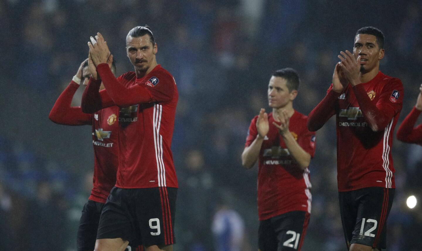 Manchester United's Zlatan Ibrahimovic, Ander Herrera and Chris Smalling applaud fans after the game