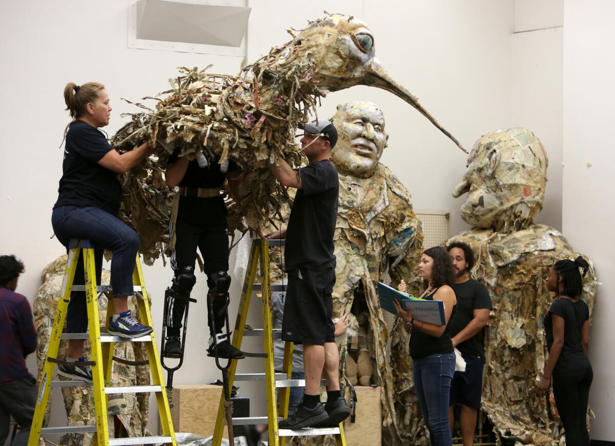 The cast and crew of the opera "Satyagraha" prepare for rehearsal at the Dorothy Chandler Pavilion in Los Angeles.