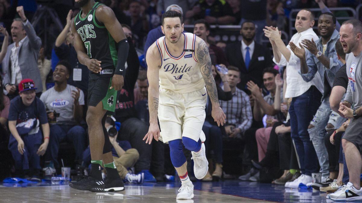 The 76ers' J.J. Redick reacts after making a three-point basket in the first quarter during Game 3 of their Eastern Conference second-round playoff series on Saturday.