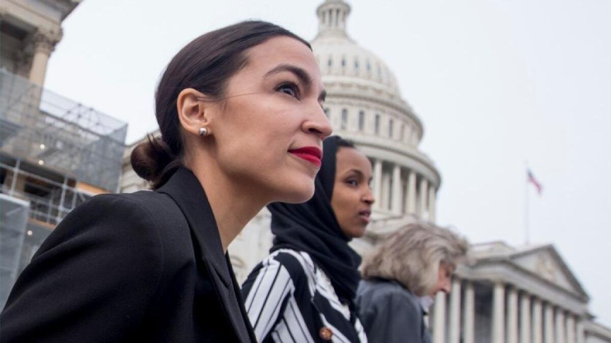 Rep. Alexandria Ocasio-Cortez (D-N.Y.) is seen with Rep. Ilhan Omar (D-Minn.) outside the U.S. Capitol.