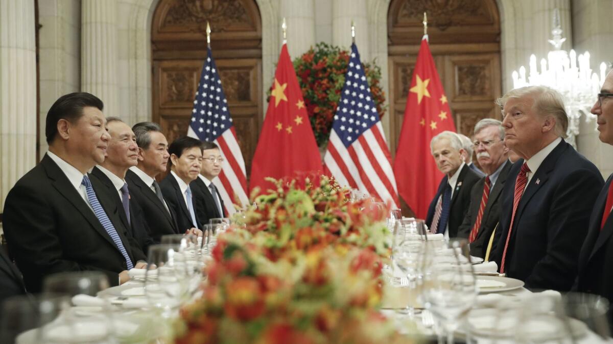 President Trump with Chinese President Xi Jinping, left, during their meeting at the Group of 20 summit. Trump started a trade war in 2018, calling himself a “tariff man.”