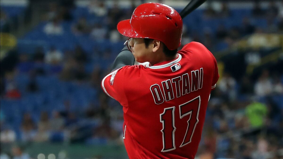 Angels' Shohei Ohtani hits a seventh-inning single Thursday against Tampa Bay to complete his first career cycle.