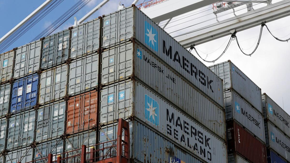 Containers wait to be unloaded from a ship at the Port of Baltimore on Oct. 24, 2016.