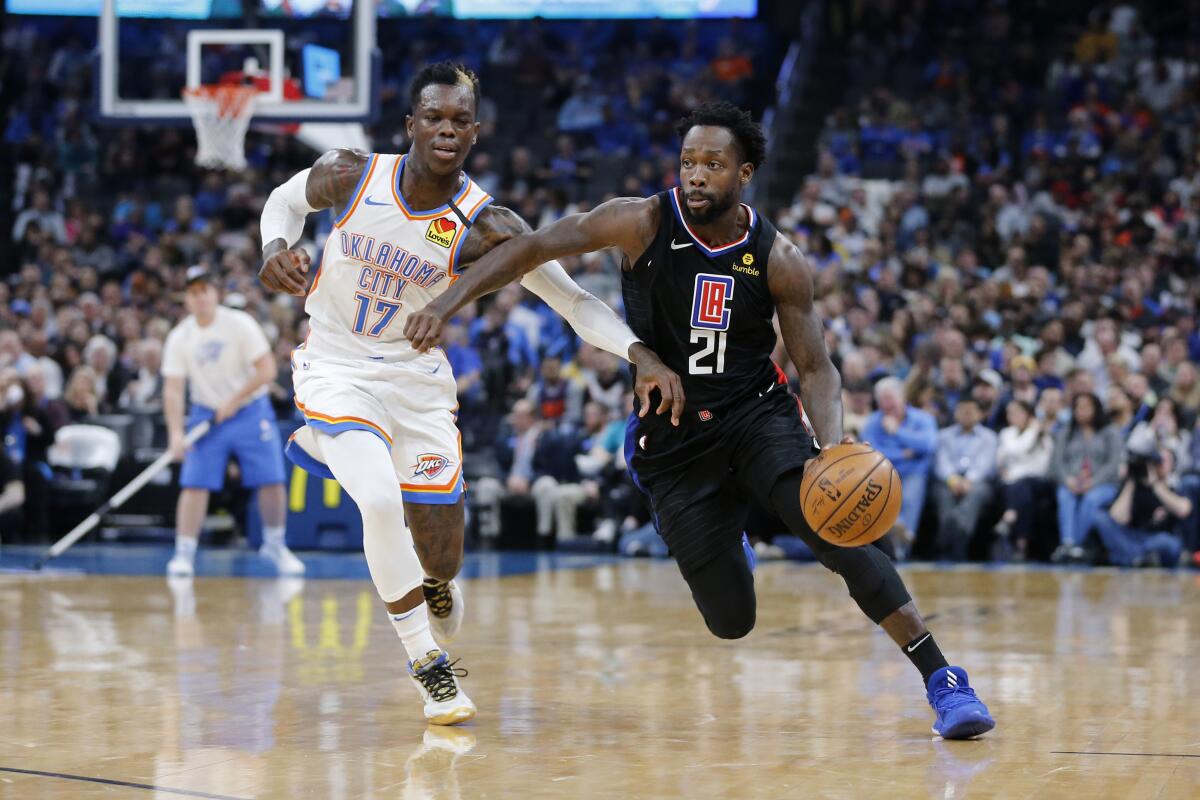 Clippers guard Patrick Beverley drives against Thunder guard Dennis Schroder during the first half of a game March 3. 