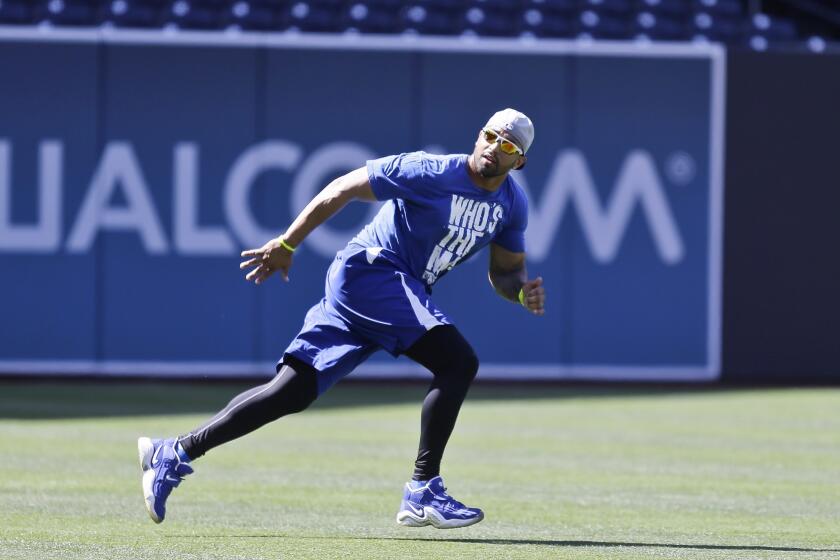 Dodgers center fielder Matt Kemp runs drills prior to the start of Thursday's game against the San Diego Padres at Petco Park.