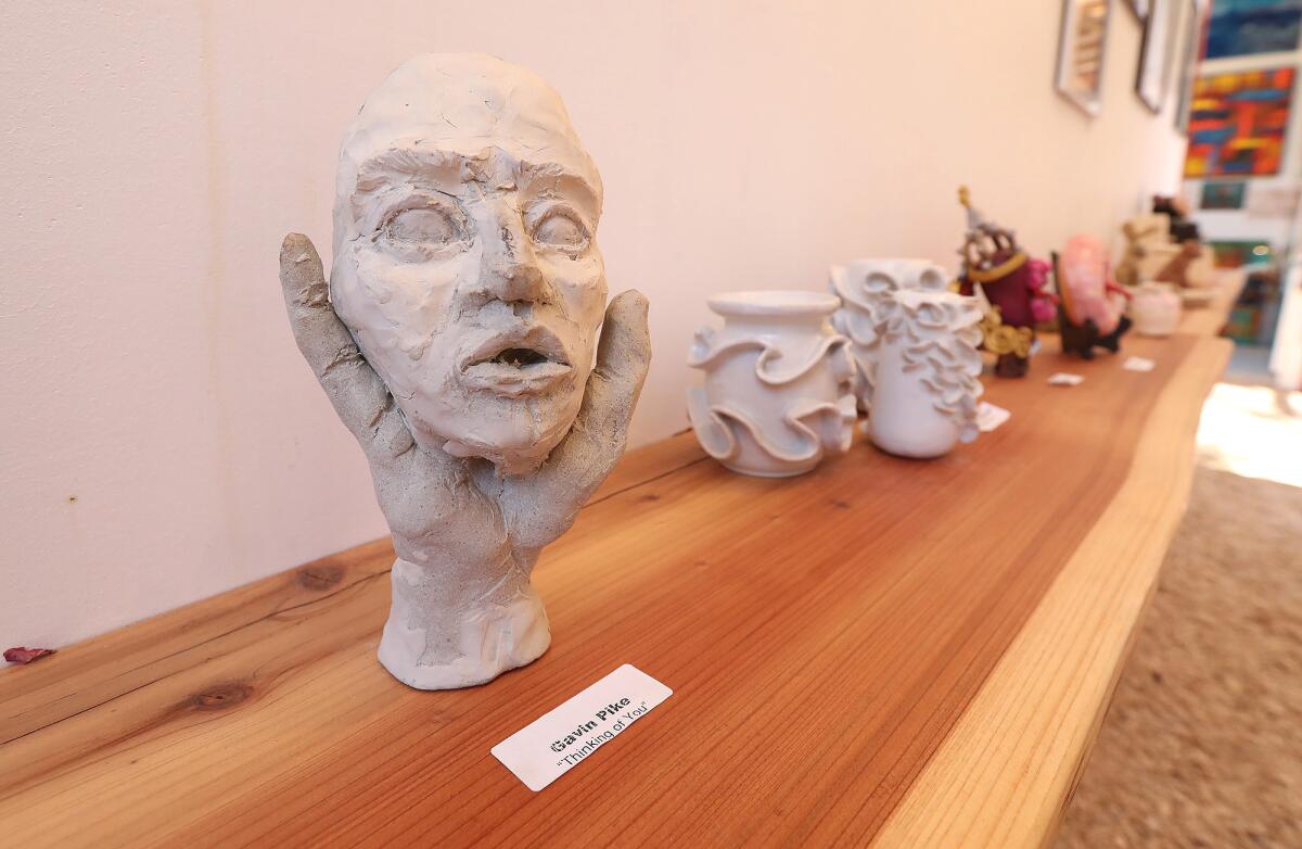 Laguna Beach High student Gavin Pike created "Thinking of You," a sculpture on display at the Sawdust Festival.