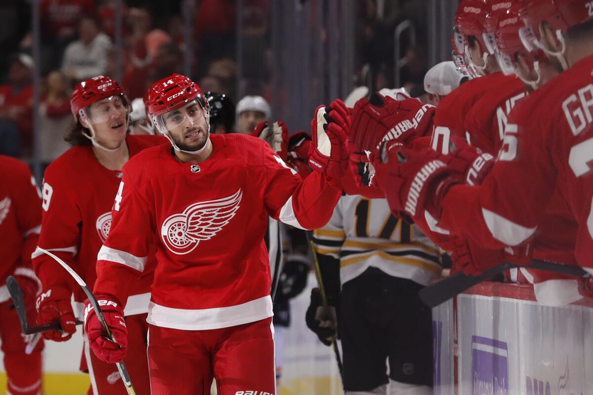 Red Wings center Robby Fabbri greets his teammates after scoring against the Bruins during the first period of a game Nov. 8.