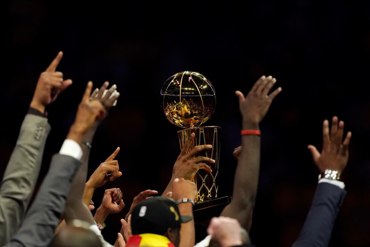 Larry O'Brien trophy is held aloft by the Toronto Raptors after their win over the Golden State Warriors on Thursday night.