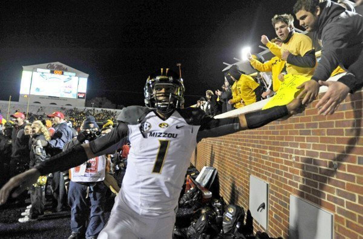 It's no joke that quarterback James Franklin, celebrating with fans after a win at Mississippi on Saturday, and Missouri moved up to No. 4 in this week's college football rankings by The Times' Chris Dufresne.