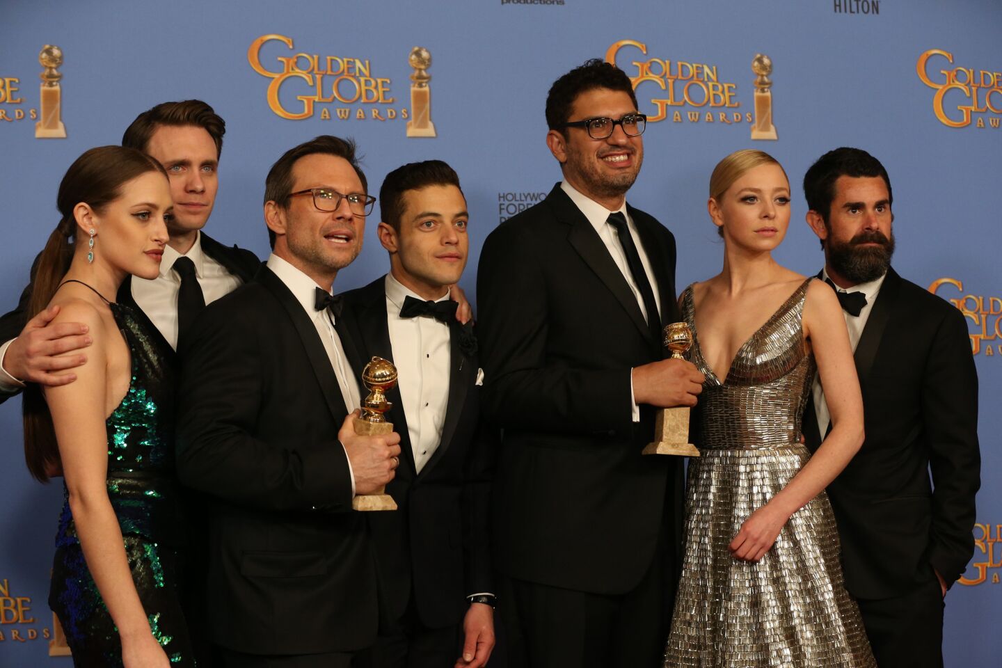 "Mr. Robot" creator Sam Esmail, center, and the cast pose together after winning the Golden Globe award for best TV series drama.