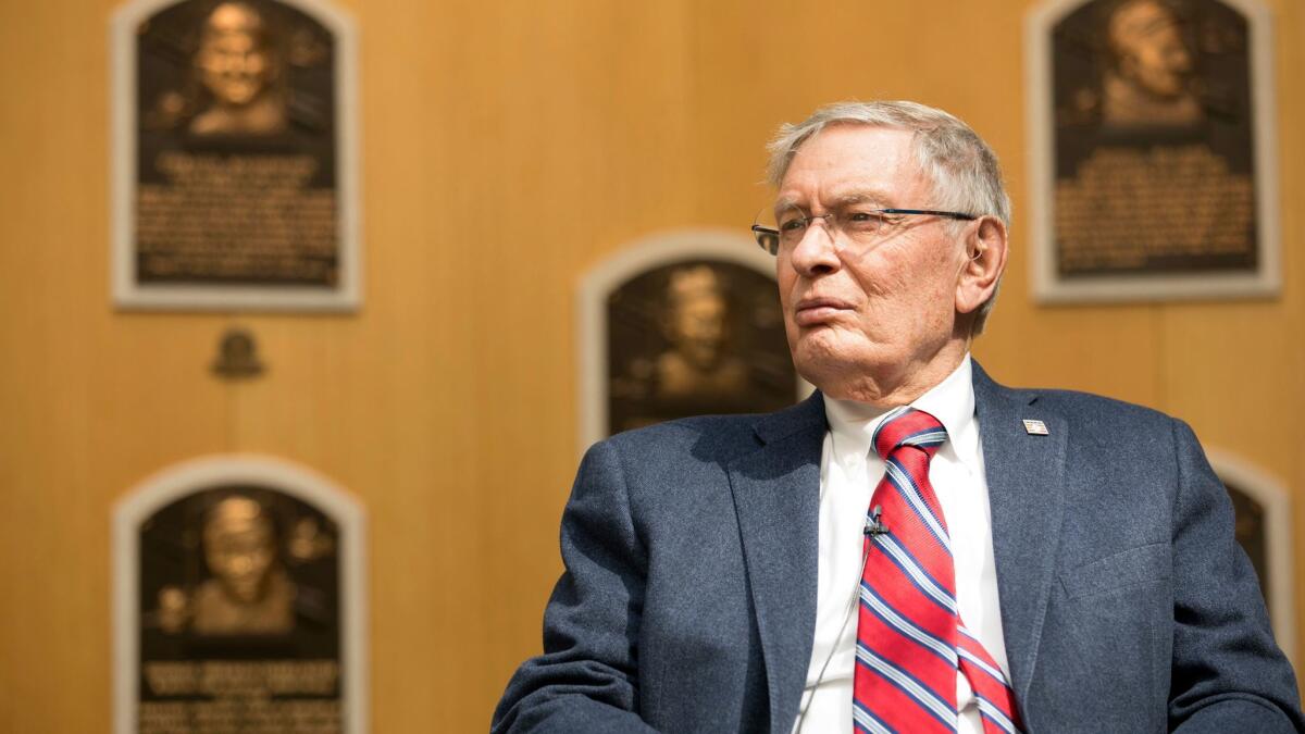 Former Major League Baseball Commissioner Bud Selig listens while touring the Hall of Fame during his orientation visit, on April 27 in Cooperstown.