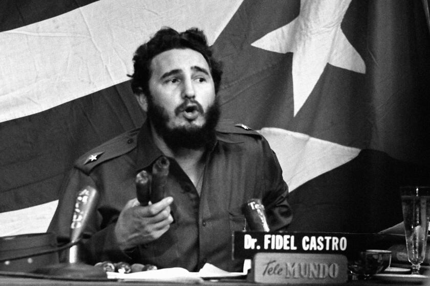 Fidel Castro accuses United States of conducting continuing campaign of hostility against Cuba: Bearded leader waving made in USA firebombs in Havana Jan. 20, 1960 he said planes from U.S.A. dropped on Cuban cane fields. He was making major television address his first such formal speech in 1960. (AP Photo)