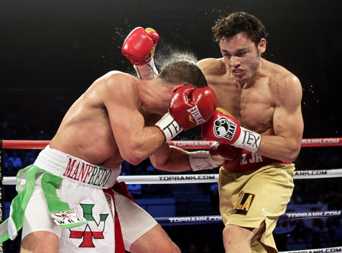 Julio Cesar Chavez Jr., right, connects with a glancing blow during his victory over Peter Manfredo Jr. in 2011. Chavez Jr. will try to get back on the winning track with a victory Saturday night over Brian Vera.