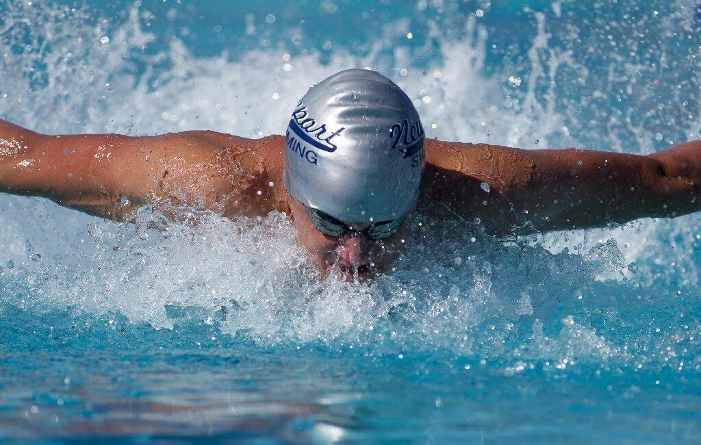 Newport Harbor High's Matthew Carlson competes in the 200-yard medley relay against Los Alamitos.