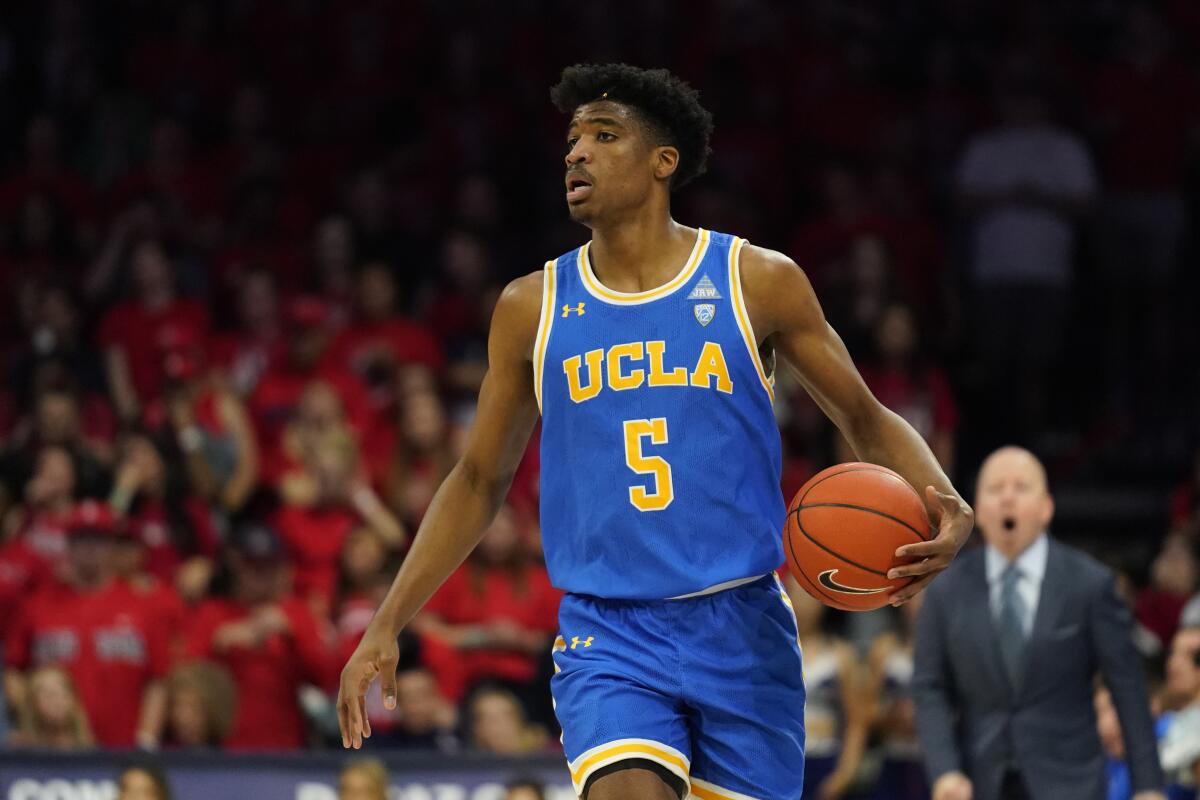 UCLA guard Chris Smith dribbles against Arizona.