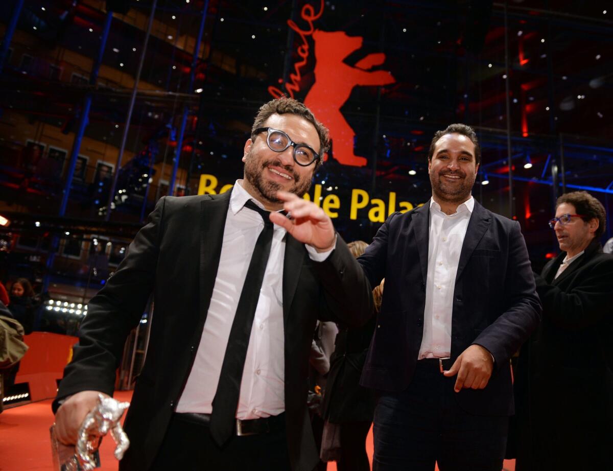 Director and writer Alonso Ruizpalacios, left, with co-writer Manuel Alcala after they won the Silver Bear for screenwriting for "Museum" at the Berlin Film Festival.