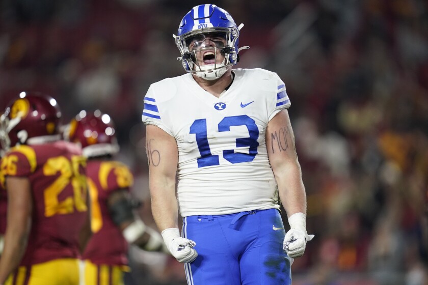 Brigham Young tight end Masen Wake (13) celebrates after running for a first down during the first half of an NCAA college football game against Southern California in Los Angeles, Saturday, Nov. 27, 2021. (AP Photo/Ashley Landis)