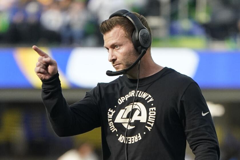 Los Angeles Rams head coach Sean McVay gestures during the first half of an NFL football game.