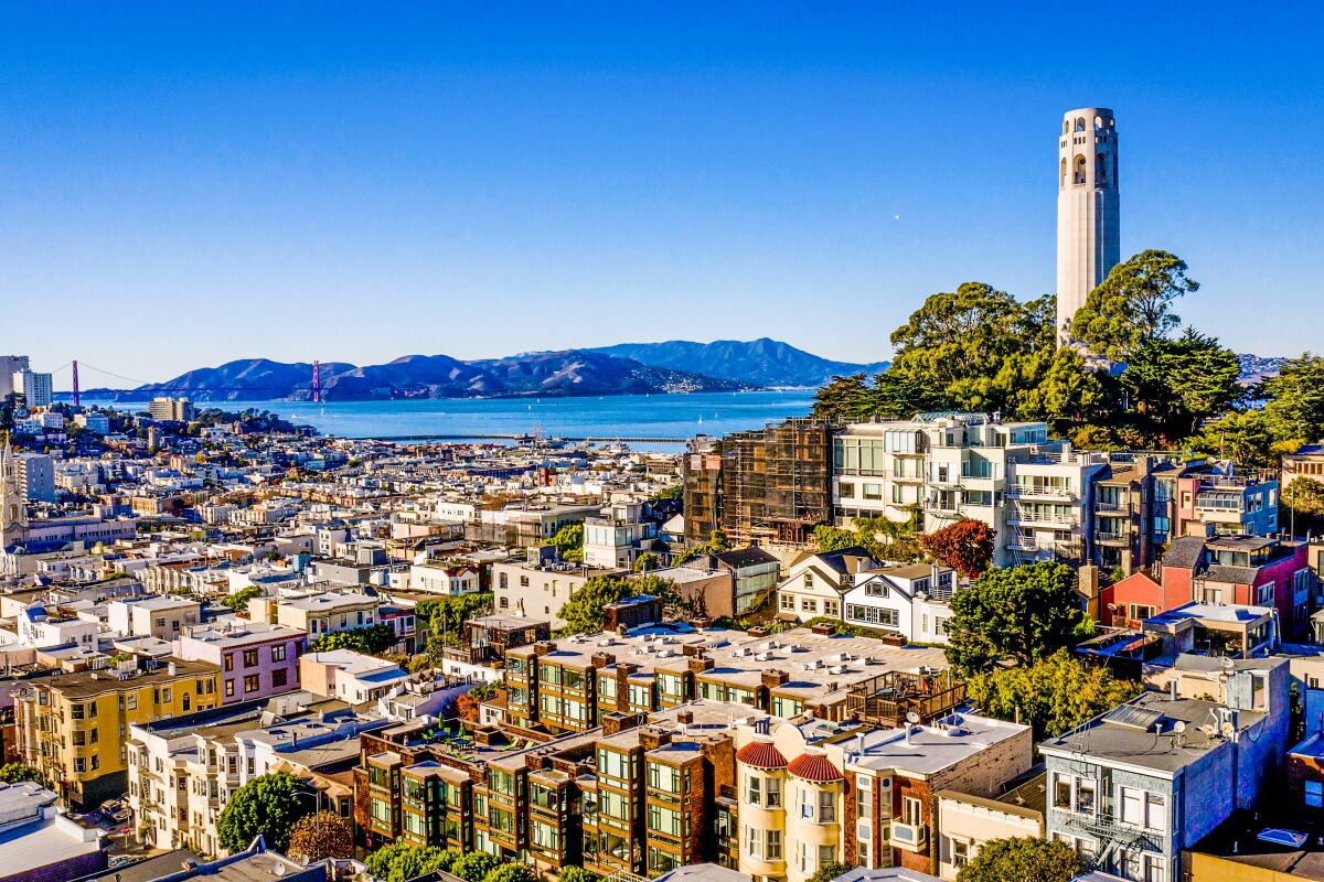 Coit Tower rises above the North Beach district of San Francisco and the surrounding neighborhood