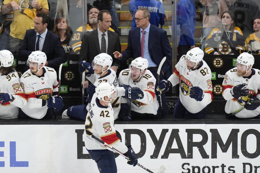 Florida Panthers' Gustav Forsling (42) celebrates after his go-ahead goal with teammates on the bench, including Vladimir Tarasenko (10), during the third period in Game 6 of an NHL hockey Stanley Cup second-round playoff series against the Boston Bruins, Friday, May 17, 2024, in Boston. (AP Photo/Michael Dwyer)
