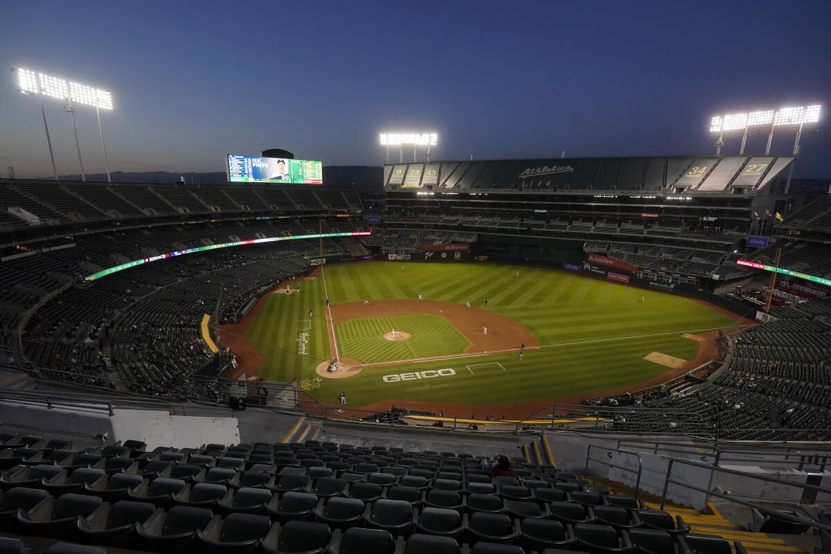 The Oakland Athletics play against the Tampa Bay Rays during a game at the Oakland Coliseum in May.