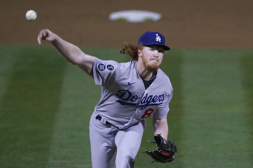 Los Angeles Dodgers pitcher Dustin May throws against the Oakland Athletics during the sixth inning.