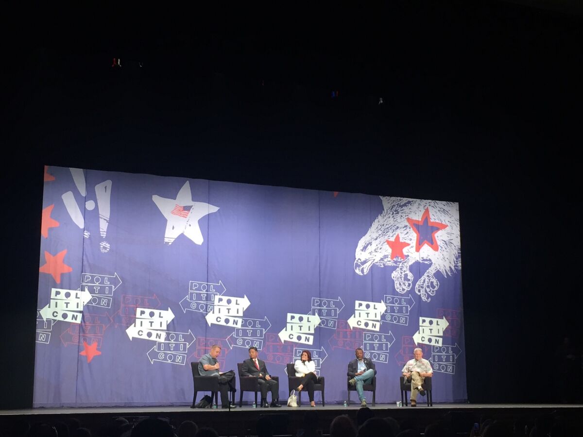 Rep. Dana Rohrabacher, right, and Rep. Ted Lieu, second from left, were among the speakers at a Politicon panel titled "From Russia with Trump."