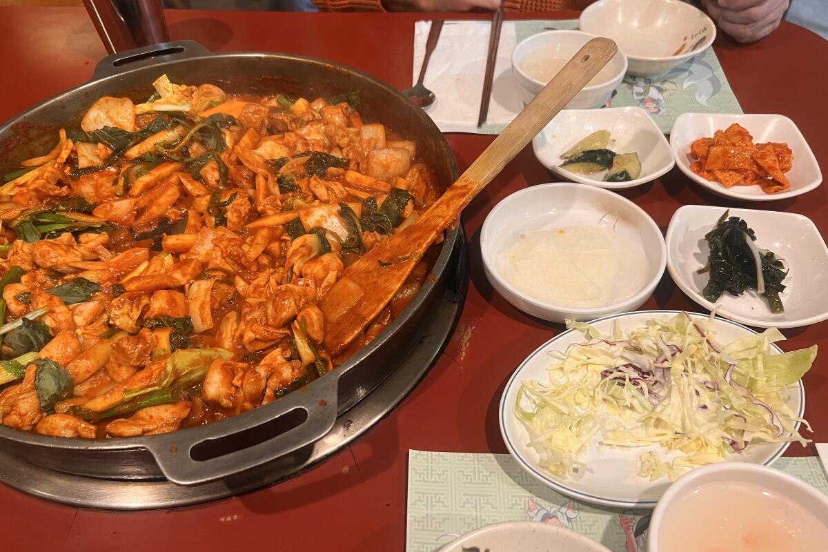 Spicy stir-fried chicken with a selection of banchan