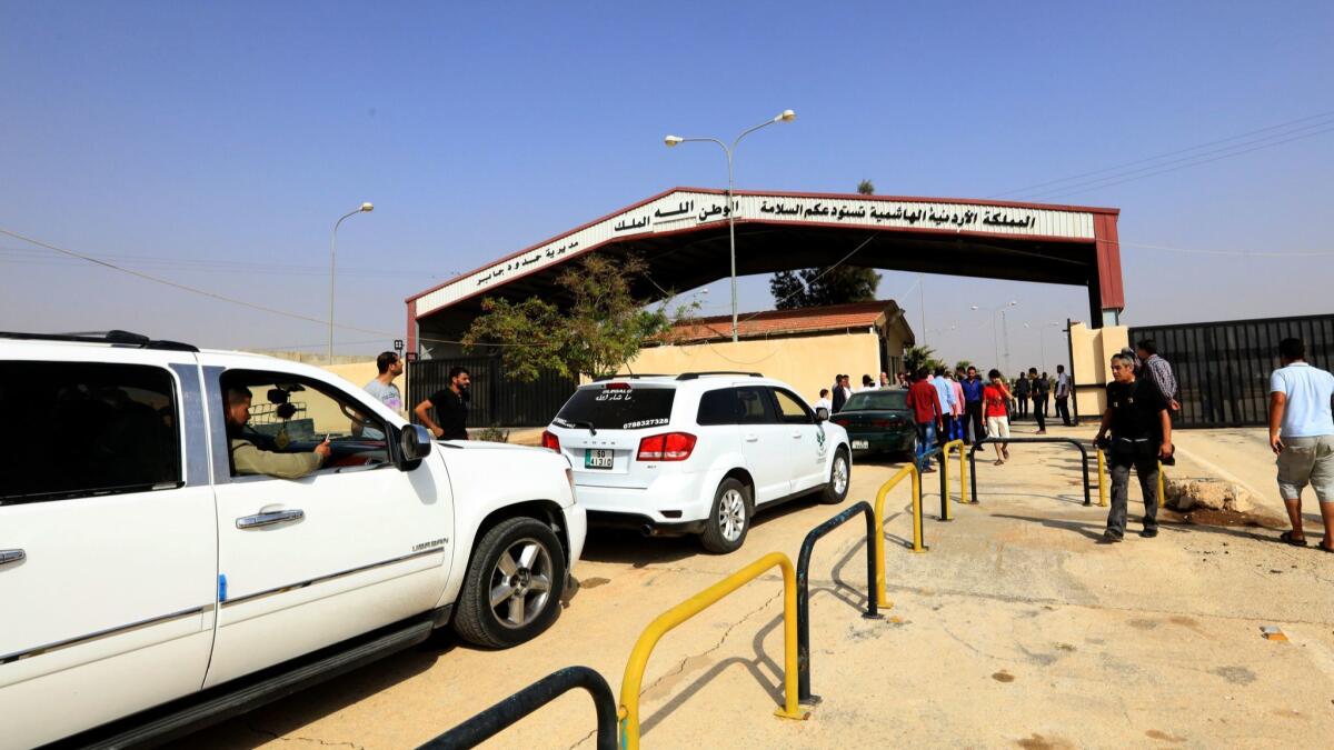 Vehicles cross from Jordan to Syria through the Jaber-Nassib border crossing after it was reopened on Oct. 15, 2018.