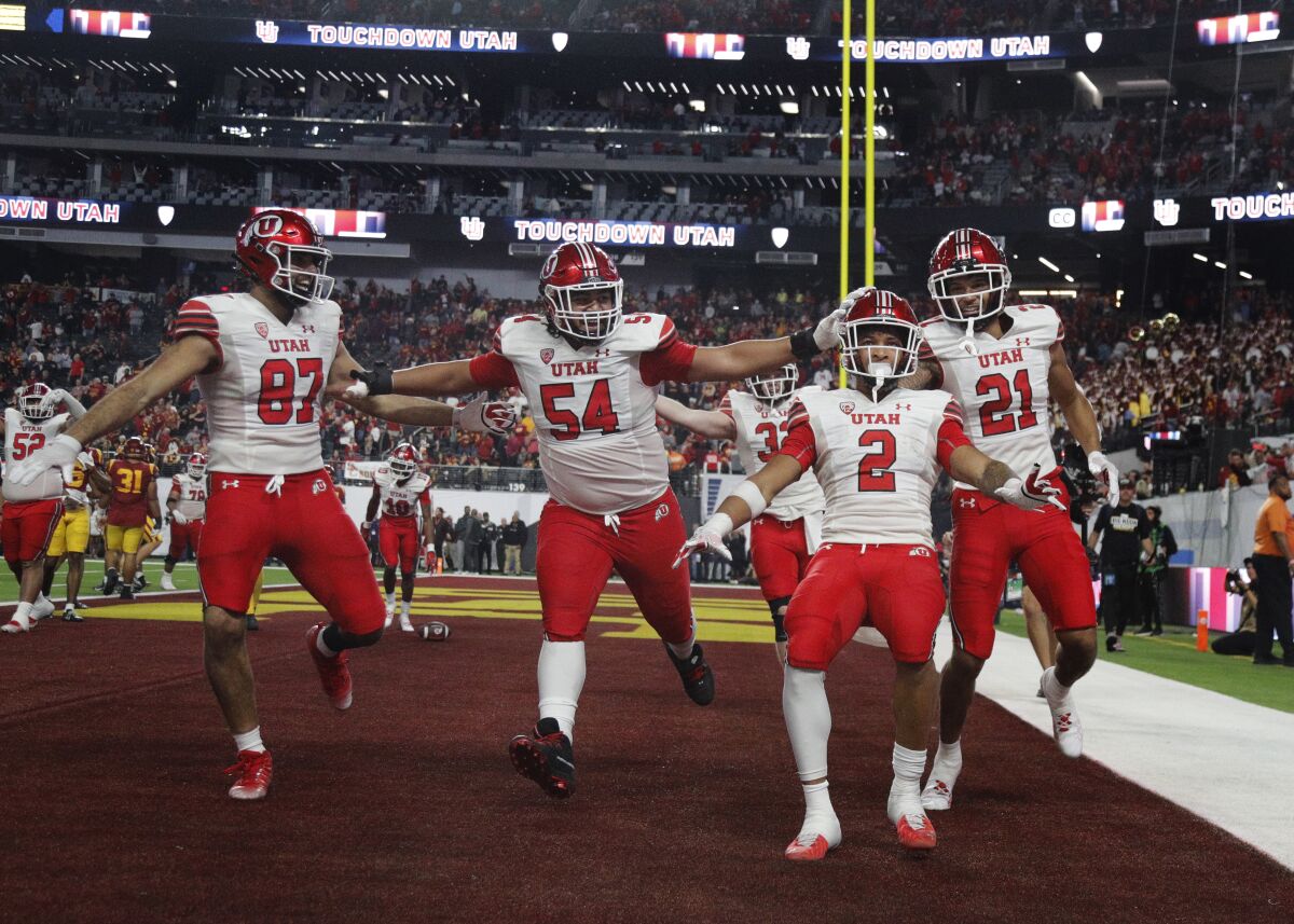Utah running back Micah Bernard (2) celebrates with teammates after scoring a touchdown in the fourth quarter.