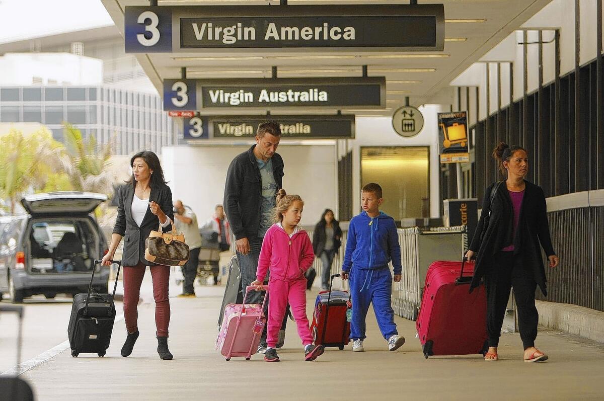 Passengers arrive at Los Angeles International Airport.