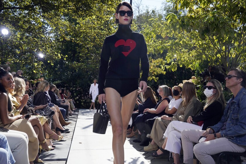 The Michael Kors Spring/Summer 2022 collection is modeled during Fashion Week, in New York, Friday, Sept. 10, 2021. (AP Photo/Richard Drew)