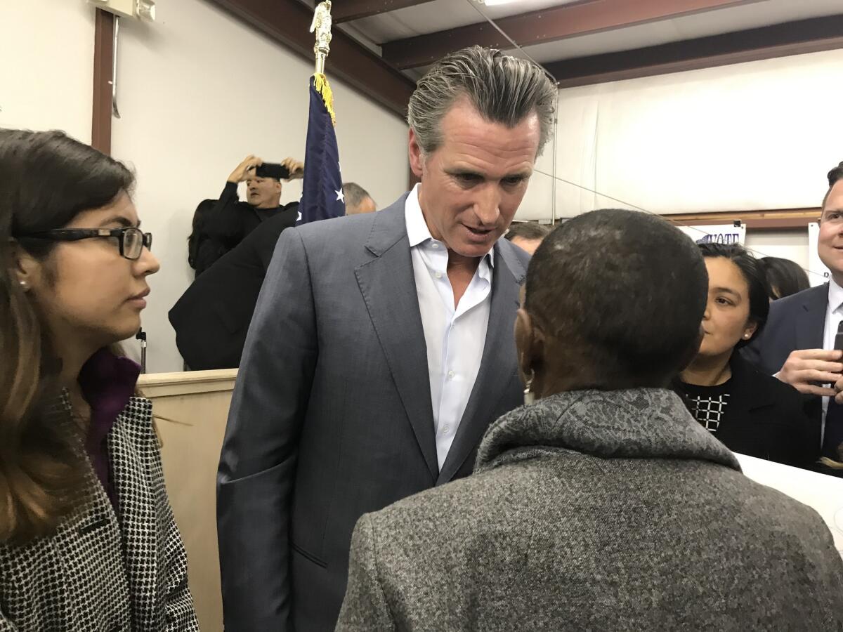 Gov.-elect Gavin Newsom talks to Fresno residents Friday after holding a town hall at the Teamsters Local 431 union hall.