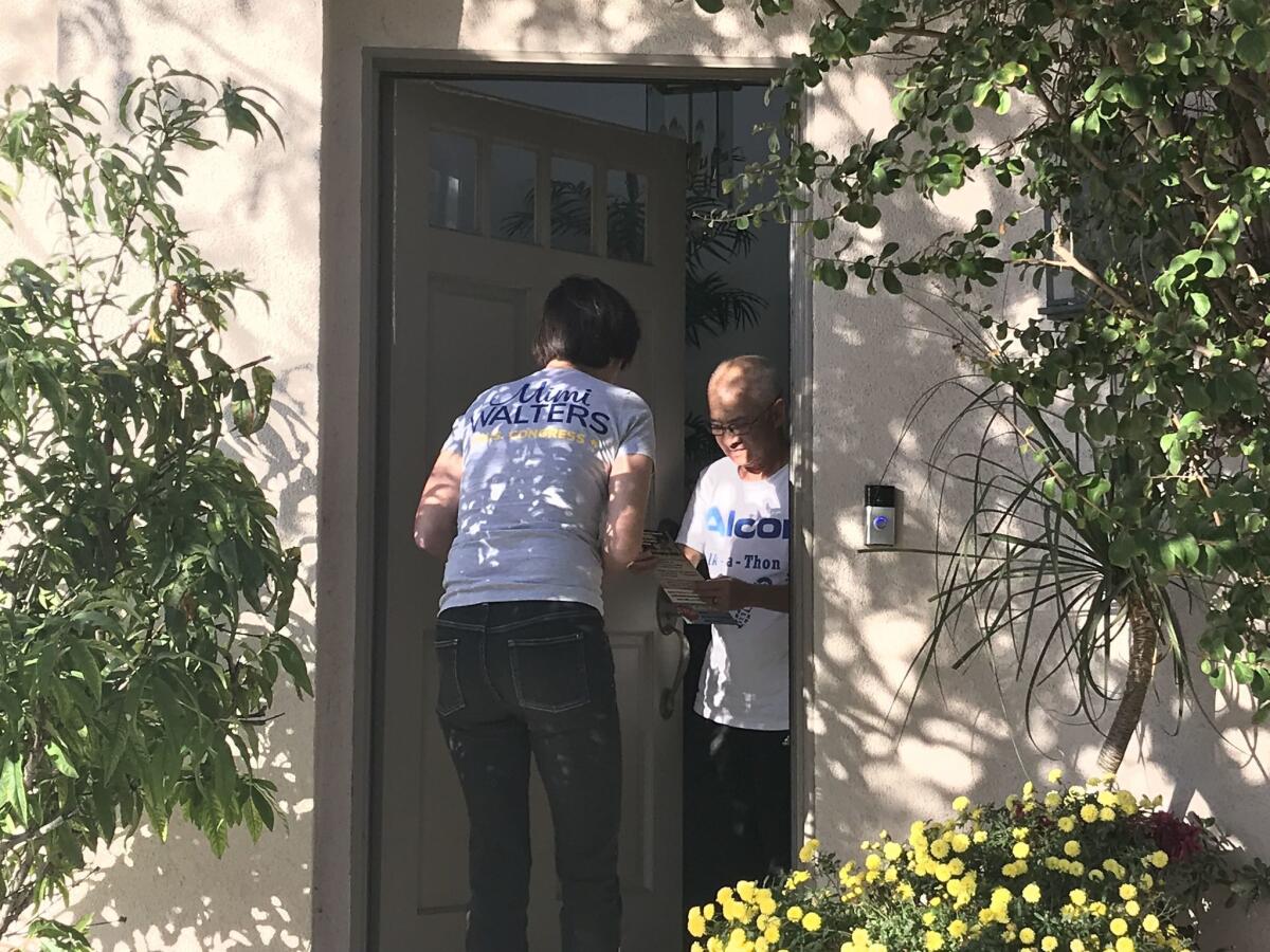 Rep. Mimi Walters knocks on doors in Irvine on Nov. 5 in a final push to get likely supporters to the polls.