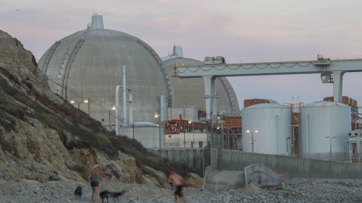 A couple relaxes on the beach next to the San Onofre Nuclear Generating Station earlier this month.