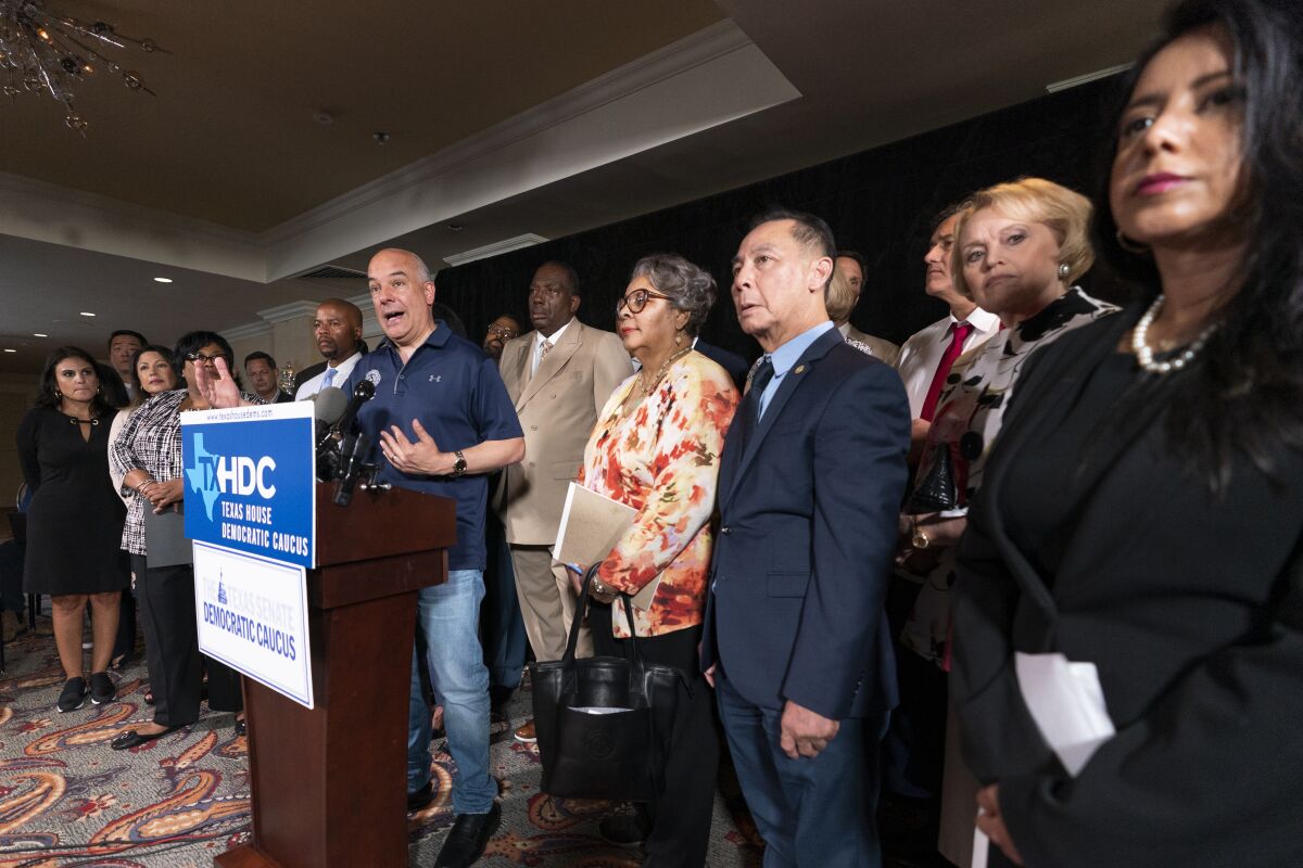Democratic Texas State Rep. Chris Turner, left, from Grand Prairie, speaks during a news conference with other Texas Democrats, Wednesday, July 14, 2021, in Washington. (AP Photo/Manuel Balce Ceneta)