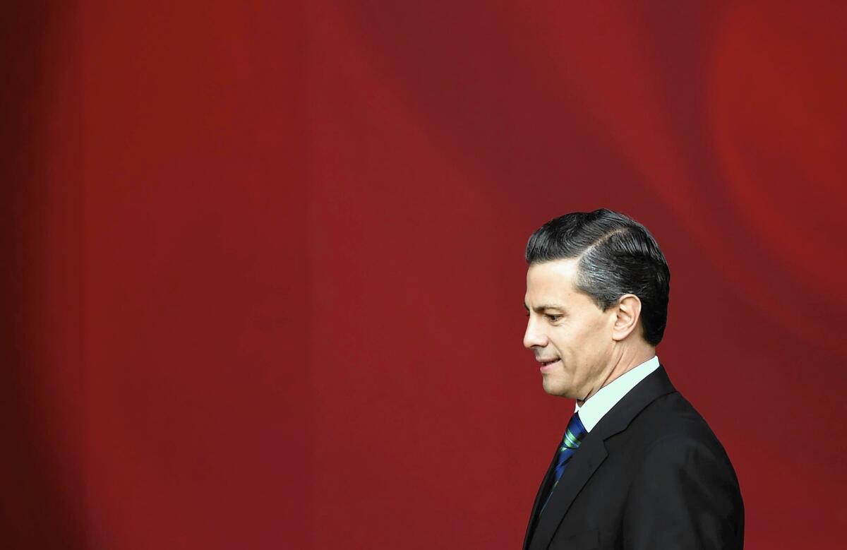 Mexican President Enrique Pena Nieto arrives Nov. 27 at the National Palace for a speech outlining a 10-point plan on security and other matters. The speech did not win him fresh support.
