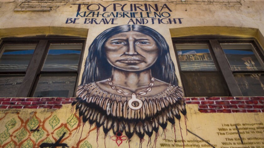 A mural in a downtown Los Angeles alleyway depicts a Native American woman known as Toypurina, a co-leader in a revolt against the San Gabriel Mission in 1785.