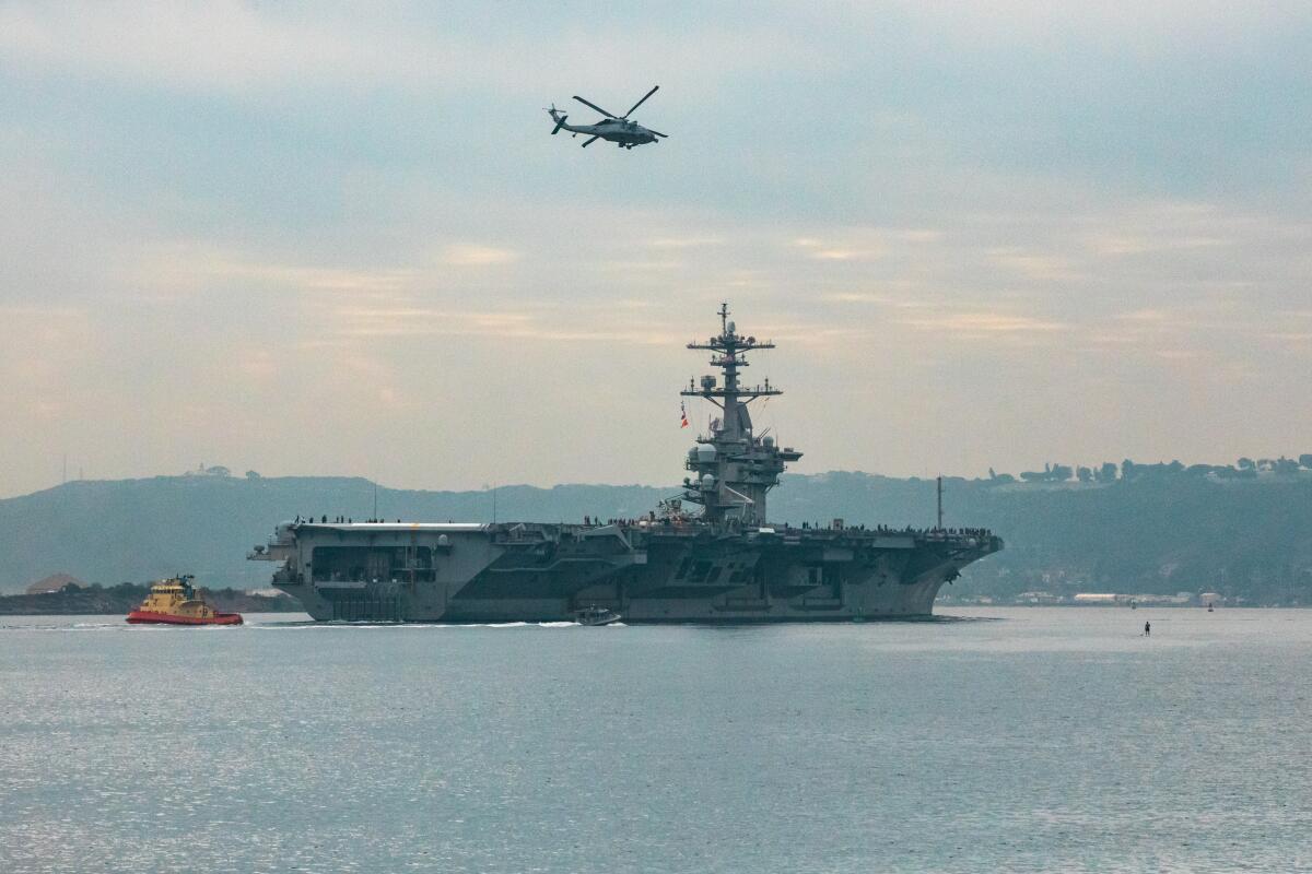 The USS Theodore Roosevelt leaves San Diego Harbor for deployment on Monday.