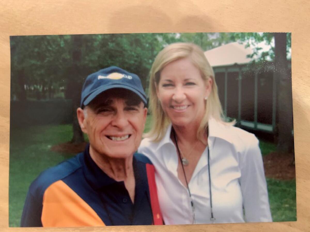 Jack Jones stands next to Chris Evert in an undated photo.