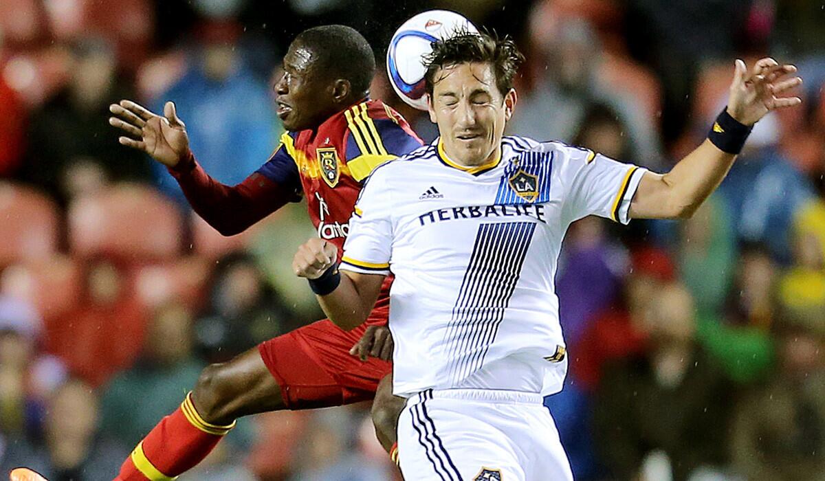 Real Salt Lake defender Demar Phillips and Los Angeles Galaxy midfielder Stefan Ishizaki head the ball during a 0-0 tie on Wednesday.