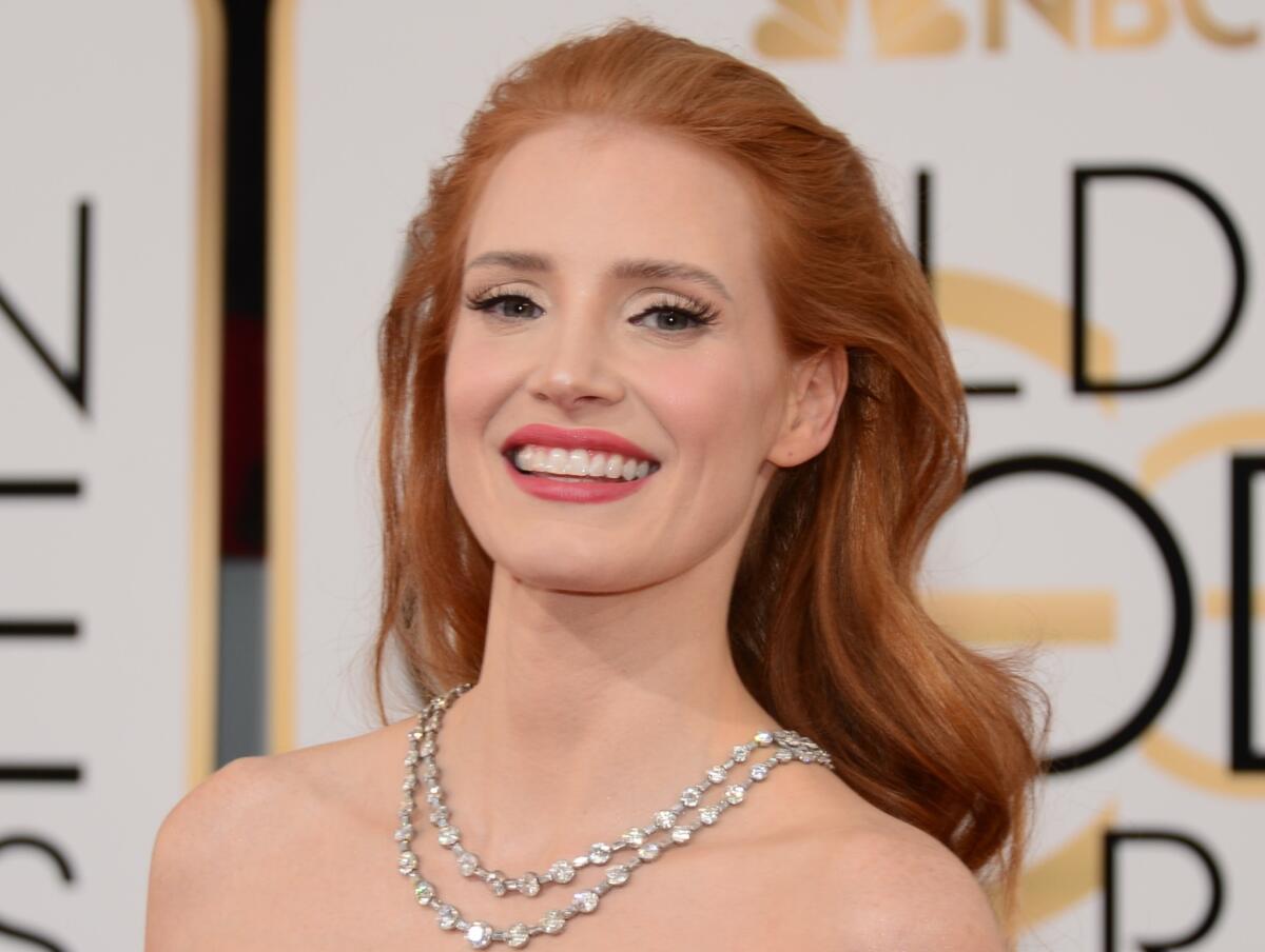 Actress Jessica Chastain's romantic hairdo helps to highlight the vintage Bvlgari necklace.