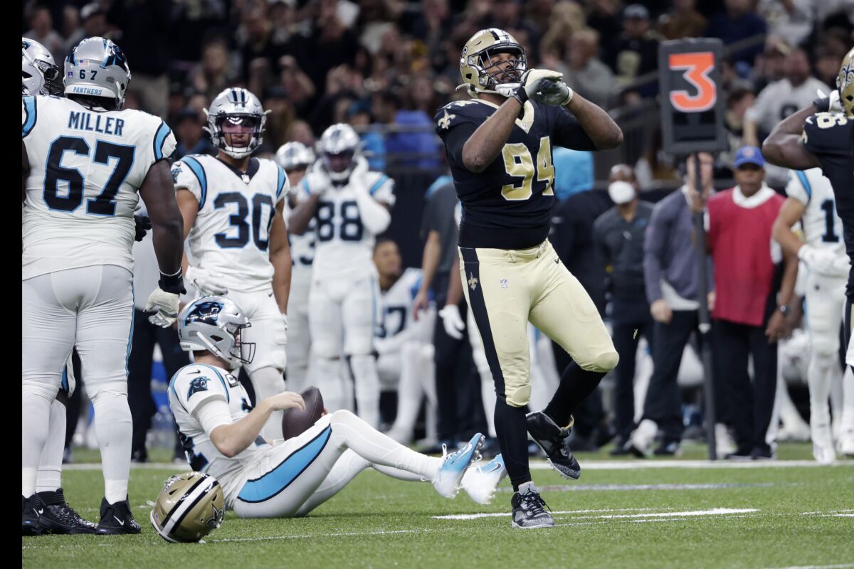 New Orleans Saints defensive end Cameron Jordan (94) celebrates his sack of Carolina Panthers quarterback Sam Darnold in the first half of an NFL football game in New Orleans, Sunday, Jan. 2, 2022. (AP Photo/Derick Hingle)