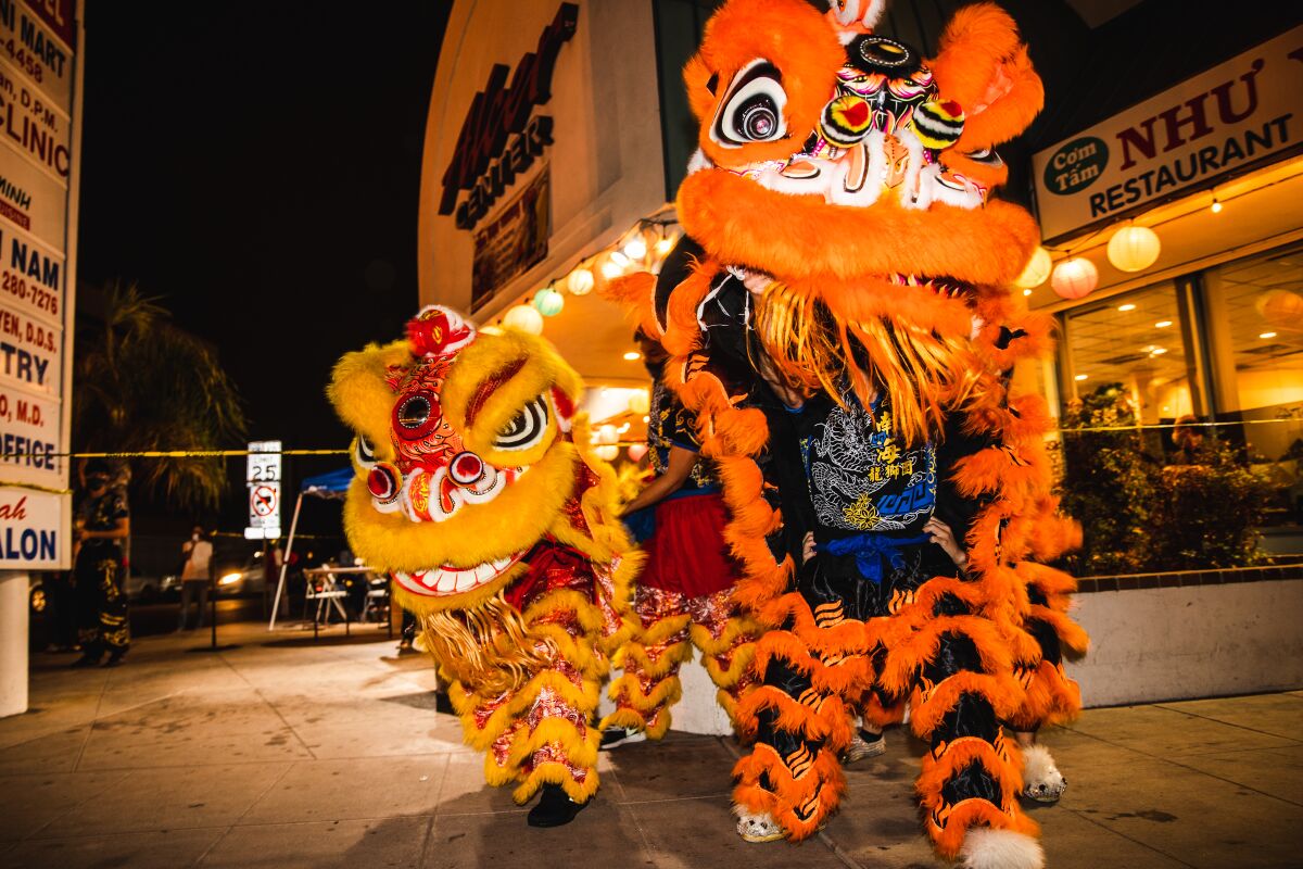Lion dancers perform in front of Nhu Y, a restaurant in City Heights’ Little Saigon community Nov. 6. 