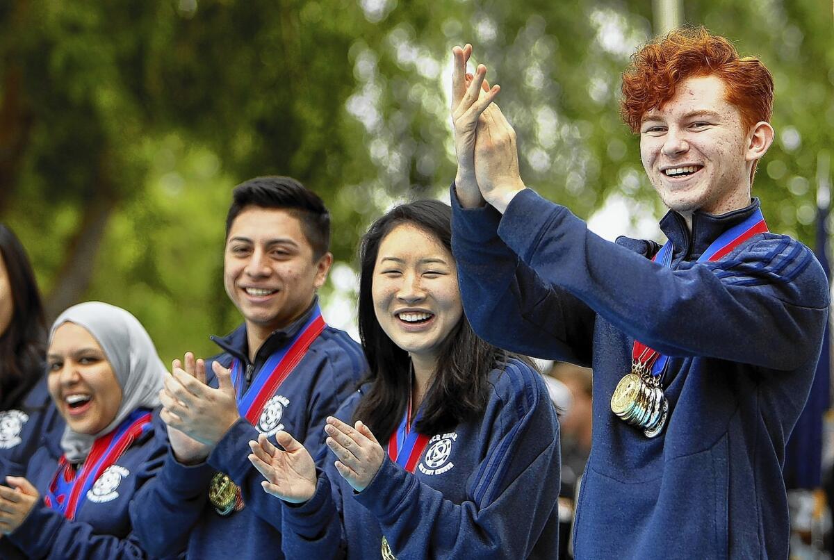 Neelem Sheikh, left, Jose Apolaya, Melissa Cheng and Rohan Boone, seen after winning the state's 2014 Academic Decathlon in March, helped the El Camino Real Charter High School team beat 52 others to win the national title.