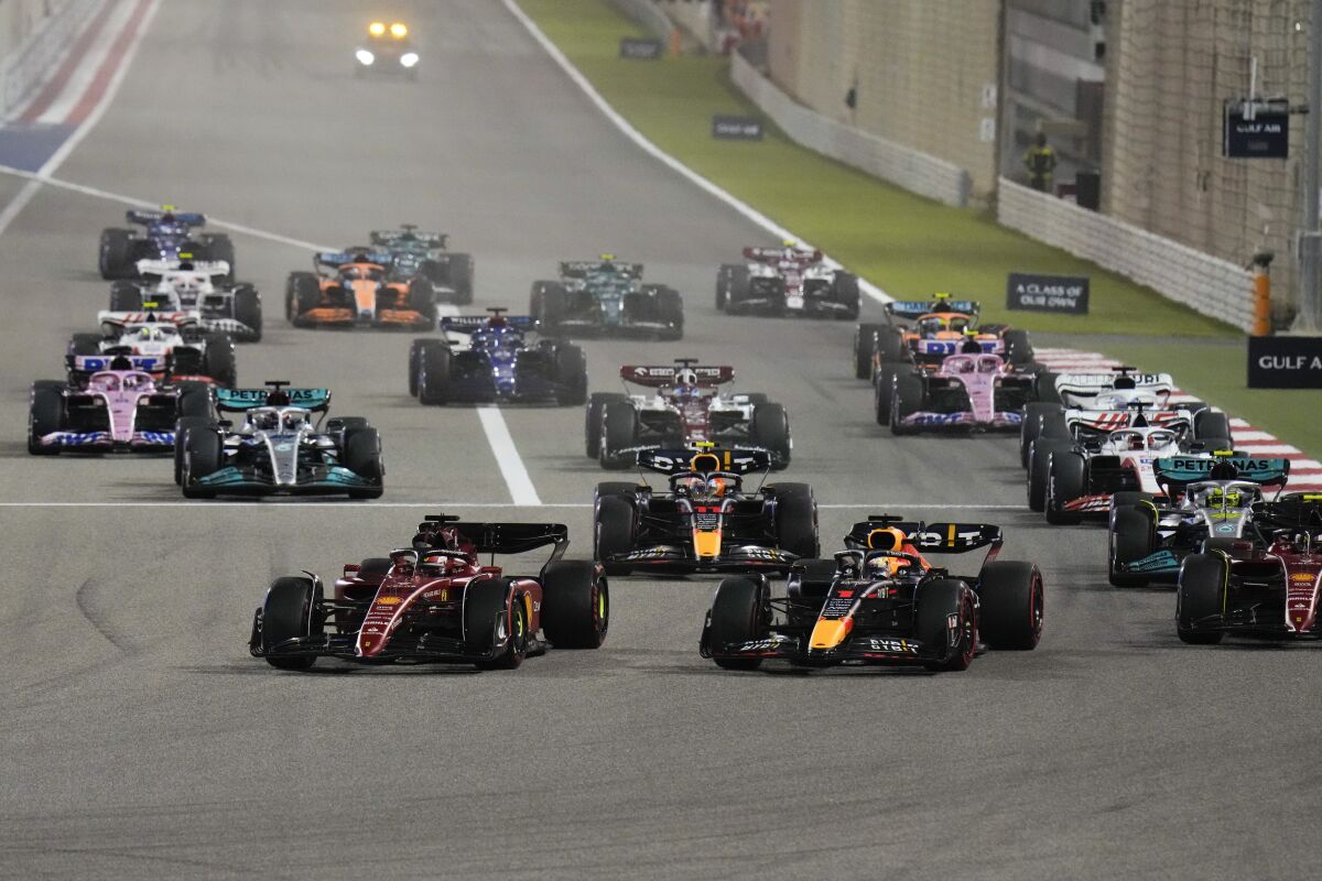 Ferrari driver Charles Leclerc, left, and Red Bull driver Max Verstappen lead at the start.